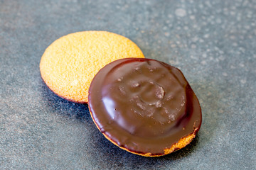 shortbread cookies with chocolate icing on a vintage background
