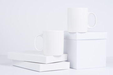 Fototapeta na wymiar two blank white coffee mug mock ups