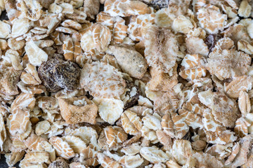 Heap of muesli isolated. Delicious granola cereal mix, with dried fruit and seeds.