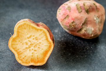 Sweet potato isolated on vintage background