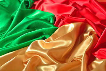 Natural golden, red and green satin fabric texture