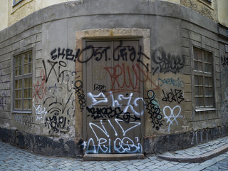 Facade of graffiti covered building, Gamla Stan, Stockholm, Sweden