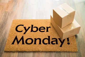 Cyber Monday Welcome Mat On Wood Floor With Shipment of Boxes
