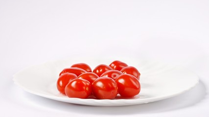 Cherry tomatoes stack isolated on white background