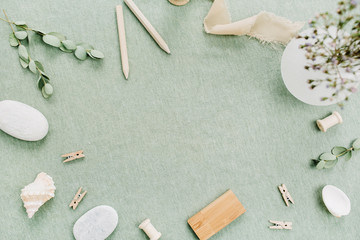 Frame of stylish female stuff on green blanket background. Flat lay, top view mock up.