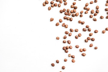 Hazelnut on white background. Flat lay, top view.