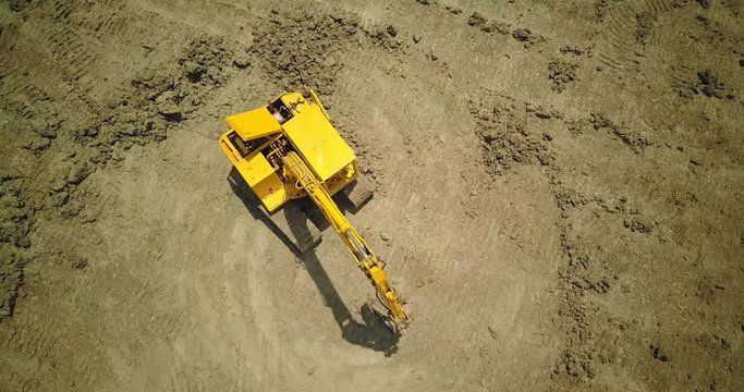  drone with camera flying to digger machine 10