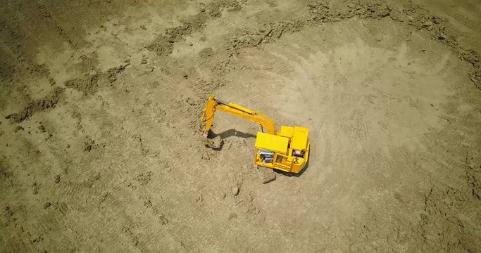  drone with camera flying to digger machine 5