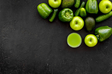 Greeny cocktail ingredients. Fitness smoothie. Cucumber, pepper, apple on black background top view space for text