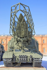 A missile system with three missiles on a caterpillar track