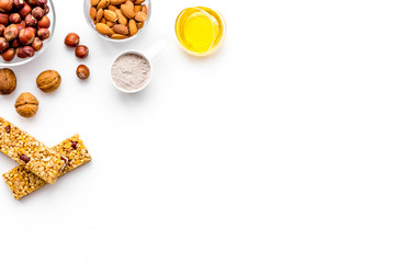 Energy protein snacks with nuts on white background top view copy space