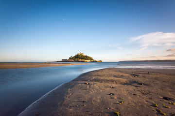 Castle on island at sea viewed from Marazion Beach, Cornwall