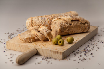 Baguette with olives and poppy seeds