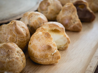 fresh baked cream puff or profiterole or choux creme.