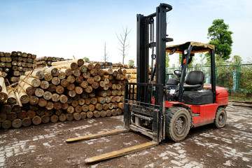 A forklift is parked in a timber factory