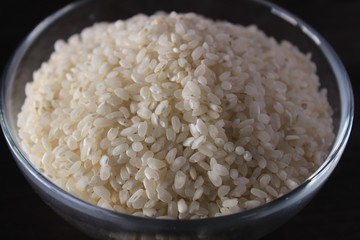 White rice texture and background in glass bowl