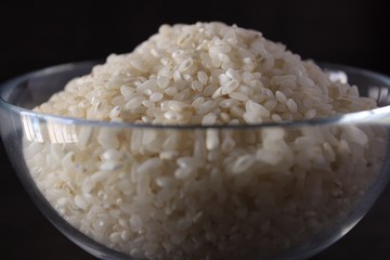 White rice texture and background in glass bowl