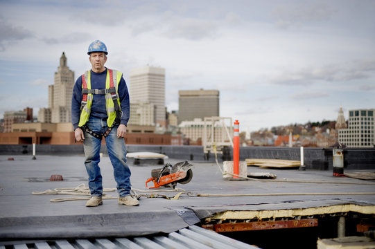 Portrait of worker standing on building