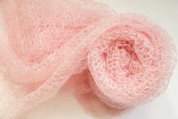 The roll of knitted fabric from mohair yarn.