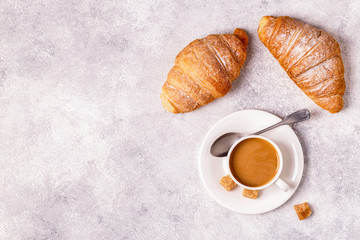 Continental breakfast with fresh croissants, orange juice and coffee.