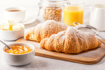 Continental breakfast with fresh croissants, orange juice and coffee