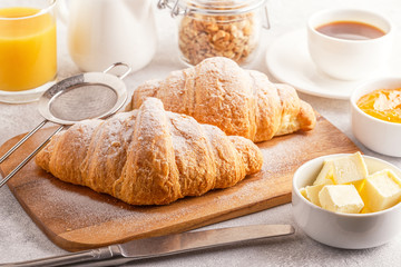Continental breakfast with fresh croissants, orange juice and coffee
