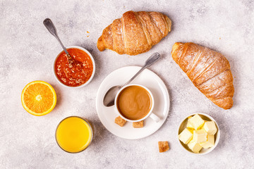 Continental breakfast with fresh croissants, orange juice and coffee.