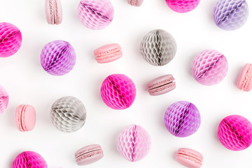 Stylish background with macaroons and lilac honeycomb balls with copy space for text. isolated on white background.