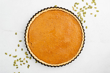 Pumpkin pie, tart. Grey stone background. Top view