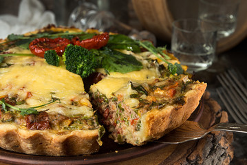 French opened pie quiche with tuna / chicken, broccoli, spinach, pepper, eggs, cheese and dried tomato.