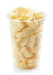 Plastic cup of pineapple pieces