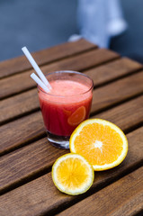 Sweet red smoothie with a straw