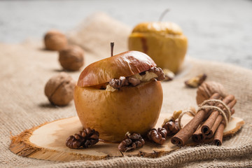 Baked apples, with honey inside. And walnut and cinnamon. Healthy diet food.