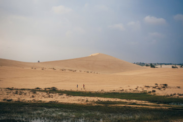 White Sand Dunes Muine in Vietnam with tourists in the summer