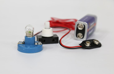 Different electrical tools on the white background . science lesson material .