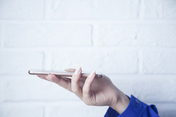 woman hand holding smart phone