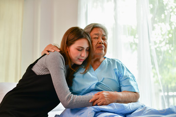Patient Concept. Grandma's in the hospital. Waiting for someone to visit. Grandchildren visit grandma at the hospital. Grandma is happy to meet grandchildren.