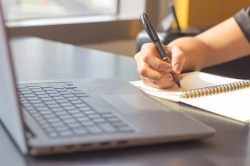 Young woman sit working in a coffee shop,Employees are working outside the company,Students are searching for reports at the restaurant,The girl is shopping online.