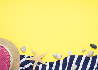 Yello travel concept for see or beach. Hat, seestar, towel, sundress with stripes. Flat layout summer.  Traveler accessories.