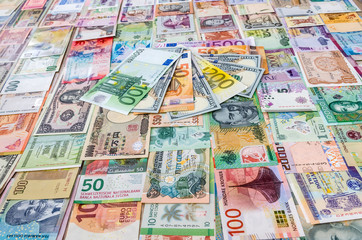 Obraz na płótnie Canvas Euro and dollar banknotes on world money collection