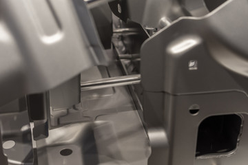 Metal parts of a car in automotive production