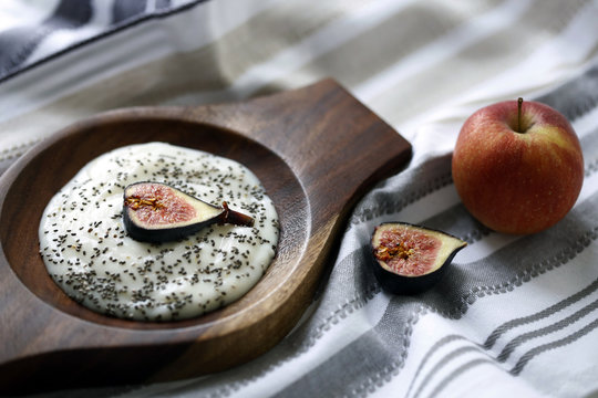 Yogurt with chia seeds and fig served in bowl