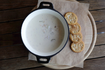 Clam chowder soup on table