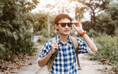 Fototapeta premium Young man traveler travel at countryside nature.
