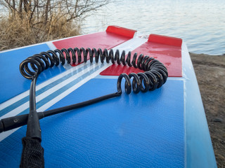 coil safety leash on paddleboard