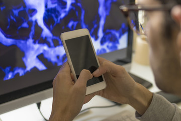 young with mobile phone and computer