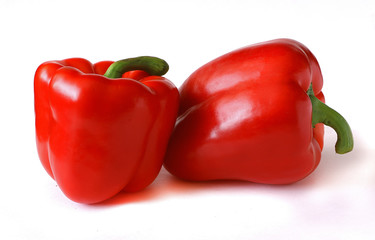 Two red peppers on white background. Vegetarian Concept, Organic Vitamins. Organic and Benefit vegetables.