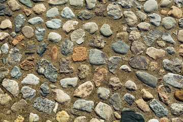 Overhead view of cobblestone street texture.