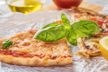 Two pieces of pizza with mushrooms and cheese