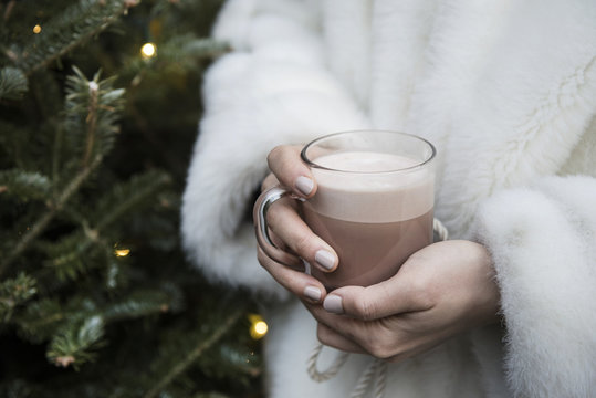 Woman holding hot chocolate in a mug